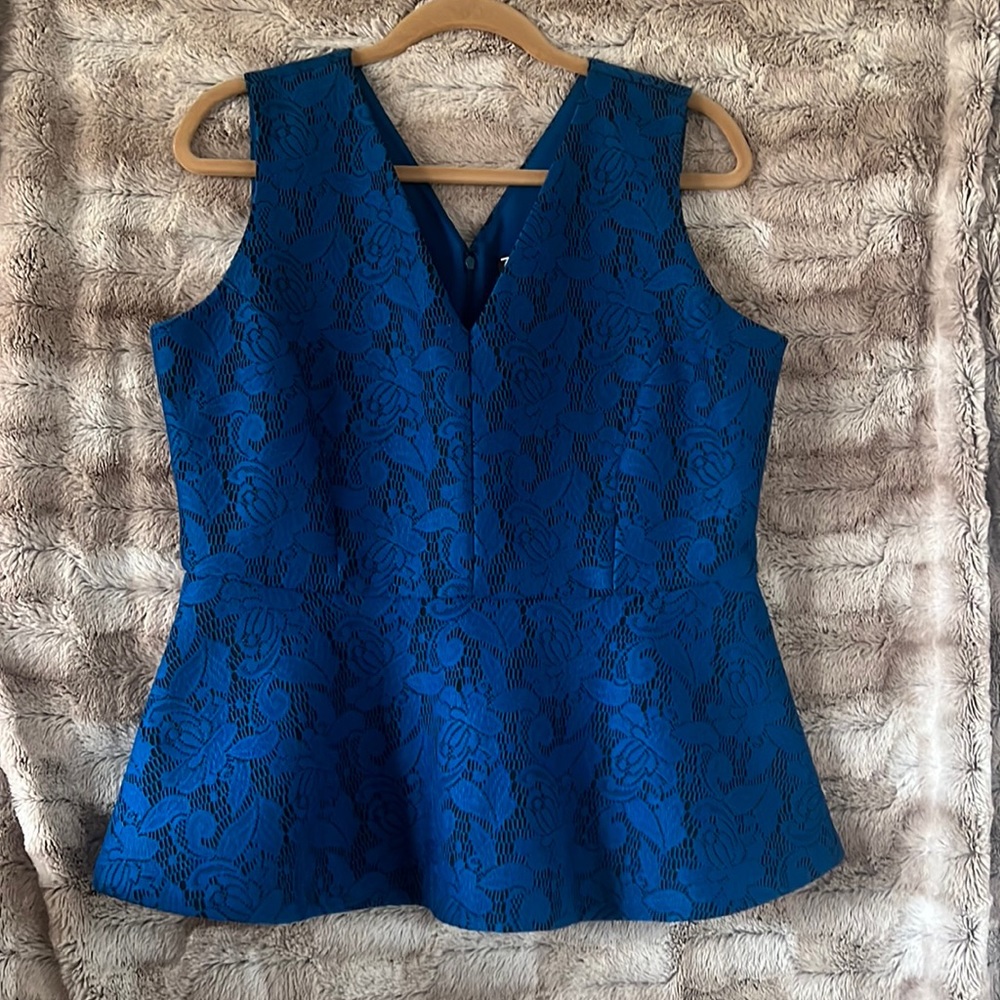 Lace details make this flared top stand out